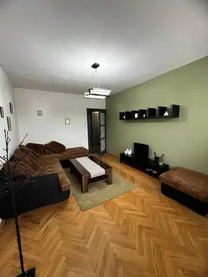 a living room with a couch and a table at Sofia Harmony Apartment in Sofia