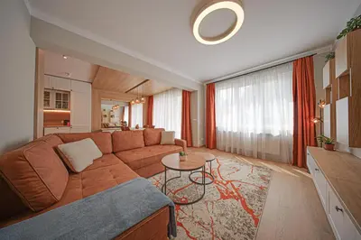 a living room with a couch and a table at Miro's Central Apartment in Sofia