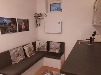 a room with a couch with pillows on it at Дом Борисови in Sofia