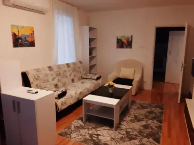 a living room with a couch and a table at Дом Борисови in Sofia