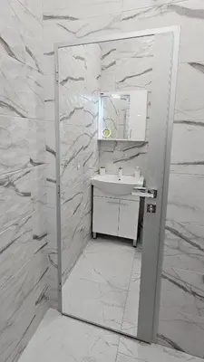 a white bathroom with a sink and a mirror at Urban Stay Sofia in Sofia