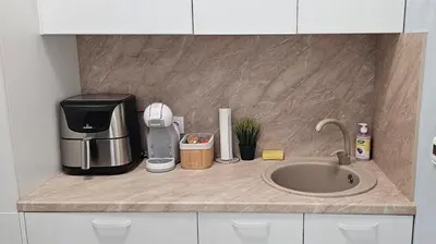 a kitchen counter with a coffee maker and a sink at Urban Stay Sofia in Sofia
