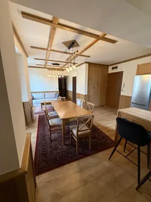 a dining room with a table and chairs at Apartment 78 by the pool in Bansko