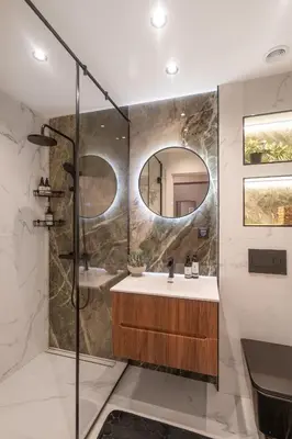 a bathroom with a sink and a shower at Amber Corner I Brand New Flat Top Location in Sofia