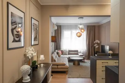 a living room with a couch and a table at Amber Corner I Brand New Flat Top Location in Sofia