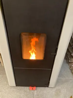 an oven with a fire inside of it at Къща за гости Рупчос 1 in Smolyan