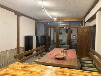 a dining room with a table with a plate on it at Къща за гости Рупчос 1 in Smolyan
