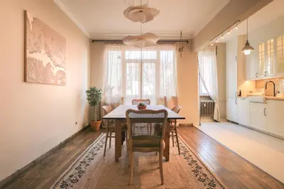 a kitchen and dining room with a table and chairs at Stylish Retreat in Sofia in Sofia