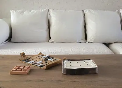 a table with a chess set on top of a couch at Stylish Retreat in Sofia in Sofia