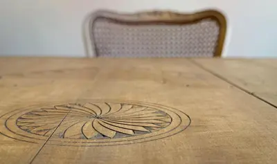 a wooden table with a flower design on it at Stylish Retreat in Sofia in Sofia