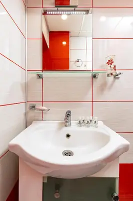 a bathroom with a white sink and a mirror at 1BD Flat in Plovdiv - 25 min Walk from the Centre by Flat Mаnаger in Plovdiv