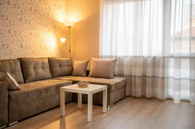 a living room with a couch and a table at Center and Old Town Apartment in Plovdiv