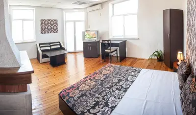 a bedroom with a bed and a television in a room at Sofia Central Guest Rooms in Sofia