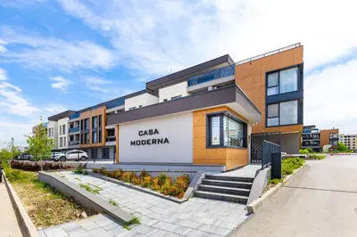 a building with a sign on the front of it at Casa Moderna - Stylish 1BD in South Plovdiv by Flat Manager in Plovdiv