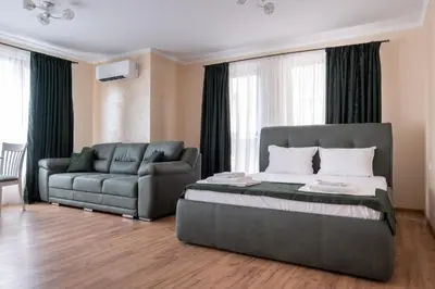 a bedroom with a bed and a couch at 5 Villa Vitosha Classic Stays in Hisarya
