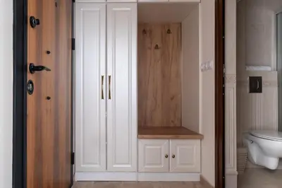 a bathroom with a toilet and a white cabinet at 5 Villa Vitosha Classic Stays in Hisarya