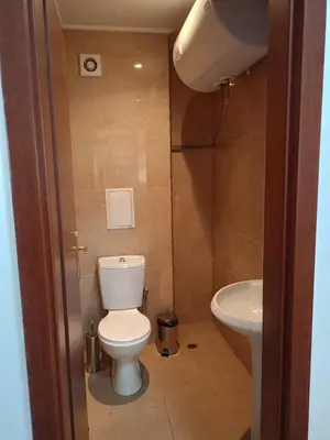 a bathroom with a toilet and a sink at Mountain Paradise 1 - 2 Bedroom - Large apartment in Bansko