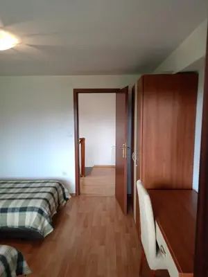 a bedroom with a bed and a closet and a door at Mountain Paradise 1 - 2 Bedroom - Large apartment in Bansko