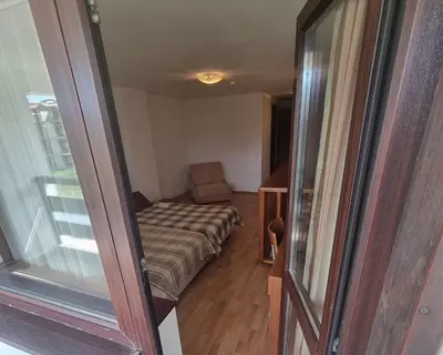 a small room with a couch and a window at Mountain Paradise 1 - 2 Bedroom - Large apartment in Bansko