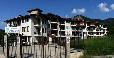 a building with a fence in front of it at Апартамент ДАРА in Smolyan