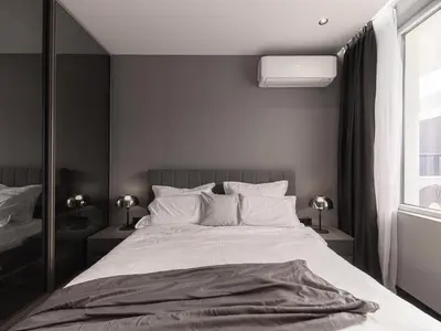 a bedroom with a large white bed and a window at APEX Apartments Sofia - MountainView in Sofia