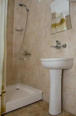 a bathroom with a sink and a shower at Guest House JoJi in Sapareva Banya