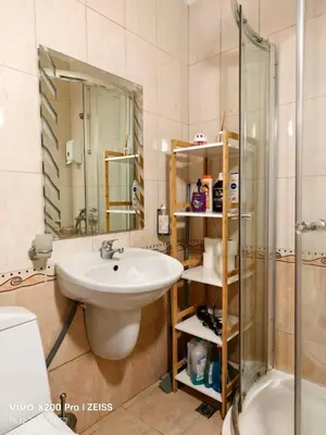 a bathroom with a sink and a shower at Lara's cosy apartment 200 m from lift in Bansko