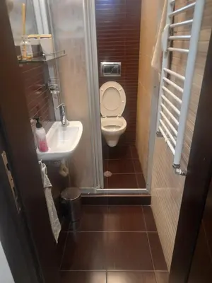 a small bathroom with a toilet and a sink at Studio Kalo in Sofia