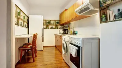 a kitchen with a washer and dryer at River Apartment in Sofia