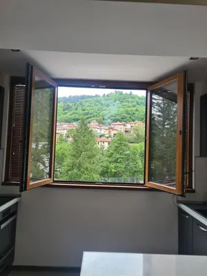 a large window in a kitchen with a view of trees at Cosmopolitan in Devin