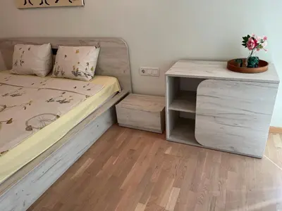 a small bedroom with a bed and a desk at Апартамент в сърцето на ПЛОВДИВ in Plovdiv