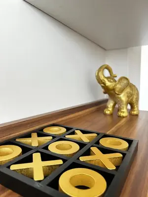 a statue of an elephant next to a table with gold objects at Rea Flora - Cozy Stay With Free Parking in Sofia