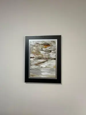 a framed picture of a painting on a wall at Apartment Garden - two large terraces with hanging chairs and sunset view in Sofia