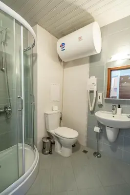 a bathroom with a toilet and a sink and a shower at Belvedere Bansko - Cozy 1BR - Ski in Winter, Swim in Summer! by Flat Mаnаger in Bansko