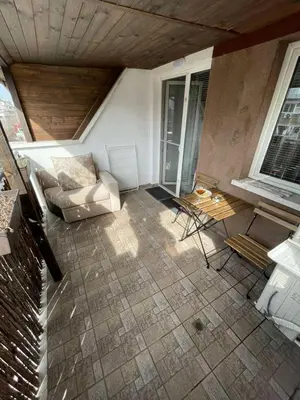 a living room with a couch and a table at Premium Nomad's Suite-Near Subway-Terrace in Sofia