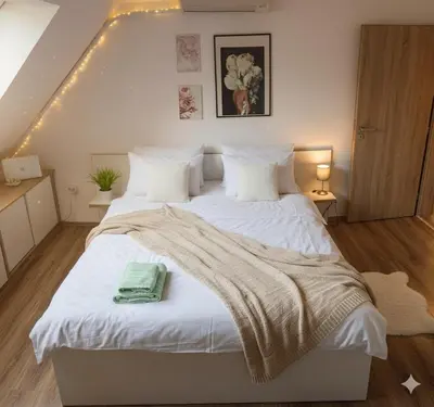a bedroom with a large white bed with lights on it at Premium Nomad's Suite-Near Subway-Terrace in Sofia