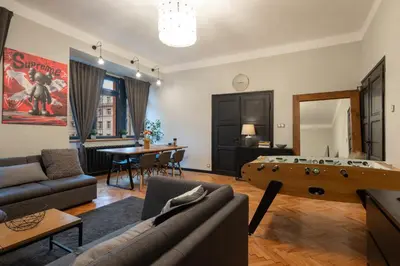 a living room with a couch and a table at Urban Oasis Heaven in Sofia