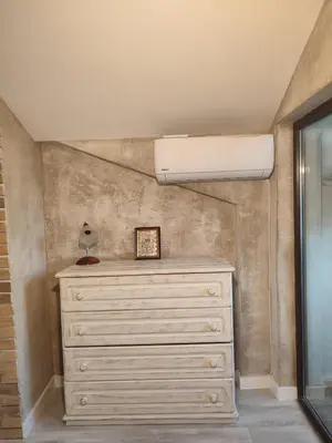 a bedroom with a dresser and ailver at Топ локация! in Bansko