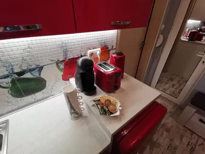 a kitchen counter with a table with food on it at D1 LOFT-Top center with free parking in Sofia