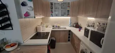 a small kitchen with a sink and a counter at Къща за гости Спирката 2 in Hotovo
