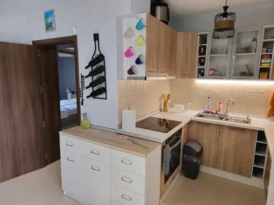 a kitchen with a sink and a counter top at Къща за гости Спирката 2 in Hotovo