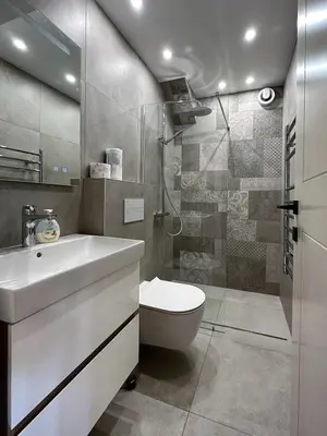 a bathroom with a toilet and a sink and a shower at Park Apartment in Sofia