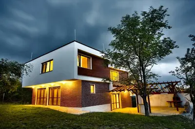a house with the lights on at night at Villa Dream in Dobrevtsi
