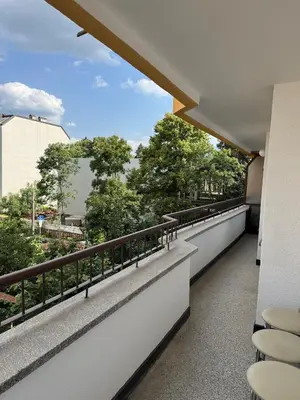 a balcony of a building with a view of trees at Contemporary Comfort in Lozenets in Sofia