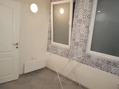 a bathroom with a mirror and a sink at MOD - Opera Plovdiv in Plovdiv