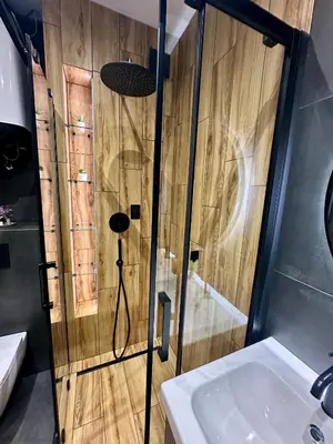 a bathroom with a shower and a sink at The Skyline Residence Sofia in Sofia