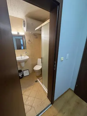 a bathroom with a toilet and a sink at Apartment 2-6 Royal Park in Bansko