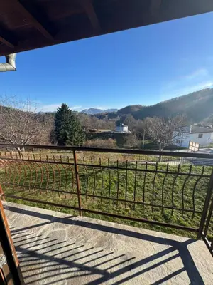 a fence in front of a field of grapes at Guest House in Rhodope Mountains in Rudozem