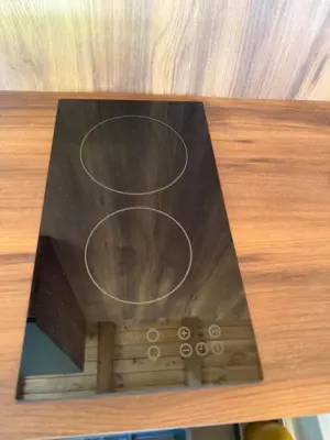 a book on top of a wooden table at Villa Green House in Tscherweni Breg