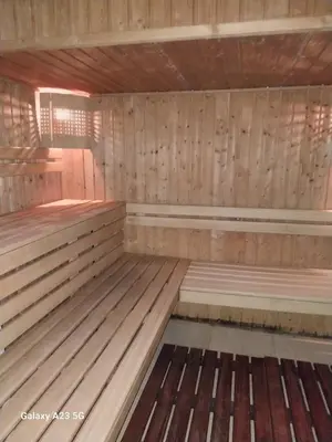 an empty sauna with wooden walls and floors at Aпартамент за гости SKI DREAM Grand Monastery-Пампорово in Pamporovo